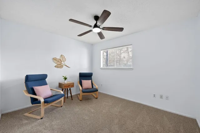 a work room with furniture and windows