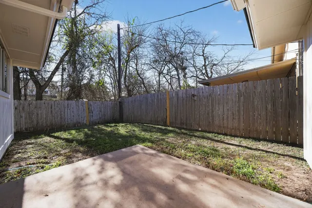 a backyard of a house with lots of green space