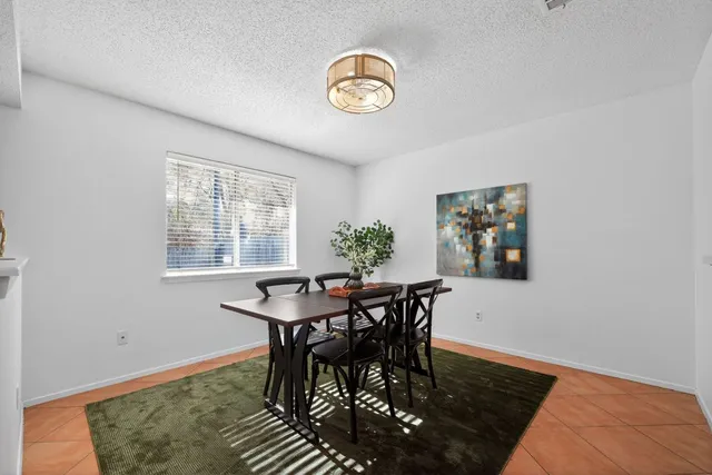 a view of a table and chairs in a room