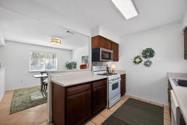 a kitchen with a stove and a sink