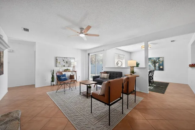a living room with furniture and a table