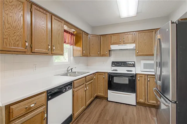 $270,000 | 404 Northeast Castle Drive, Lee's Summit, MO 64086