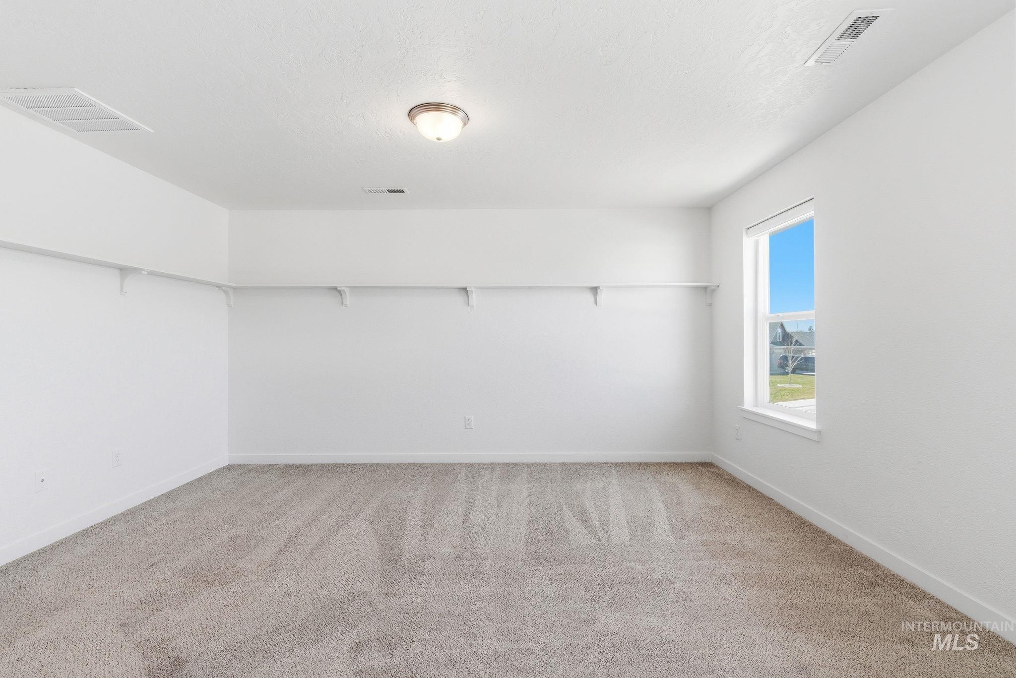 110 Homesteaders Street Middleton, ID 83644 - Photo 24 of 49 Spare room with carpet floors and baseboards