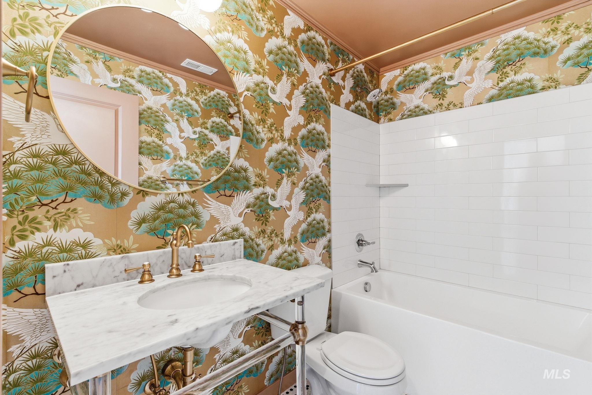 110 Homesteaders Street Middleton, ID 83644 - Photo 35 of 49 Full bath featuring wallpapered walls, washtub / shower combination, and ornamental molding