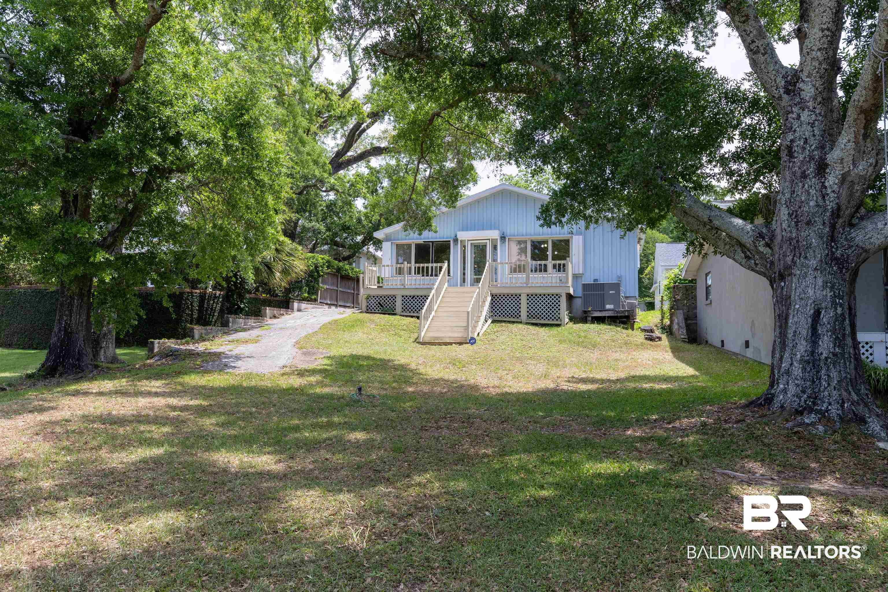 724 Mobile South Street Fairhope, AL 36532 - Photo 4 of 38 Exterior space with a lawn and a deck