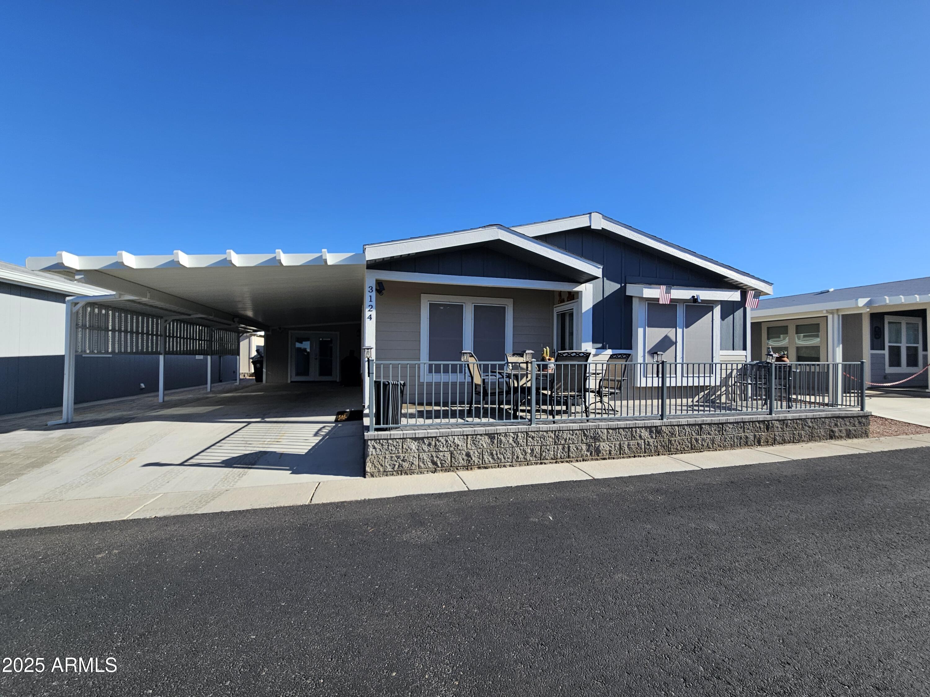 650 North Hawes Road, Unit 3124 Mesa, AZ 85207 - Photo 1 of 45 a front view of a house with a porch