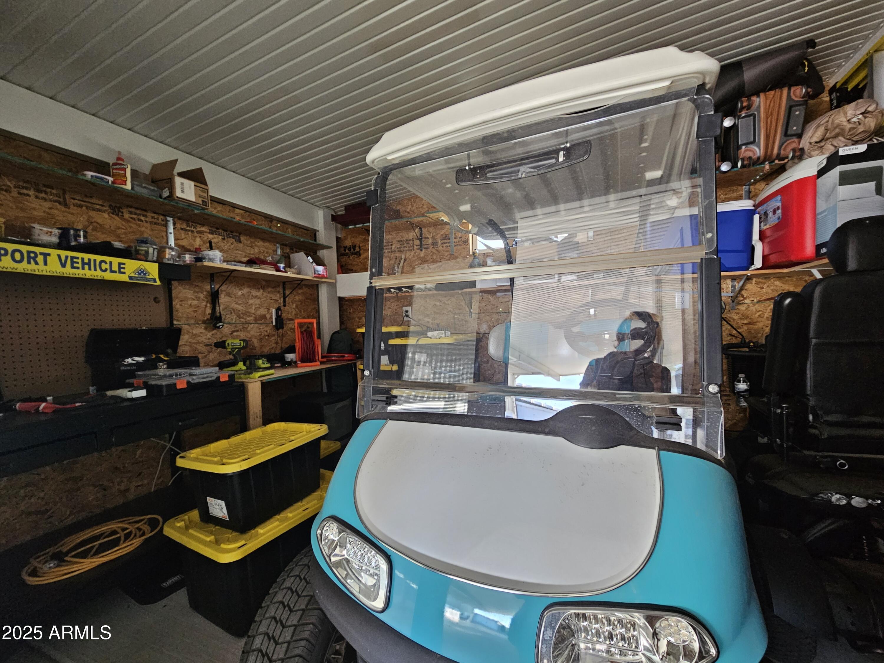 650 North Hawes Road, Unit 3124 Mesa, AZ 85207 - Photo 11 of 45 a room with lots of furniture and clutter