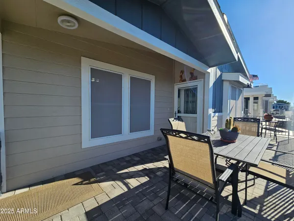 a kitchen with a refrigerator a sink dishwasher a stove and white cabinets with wooden floor