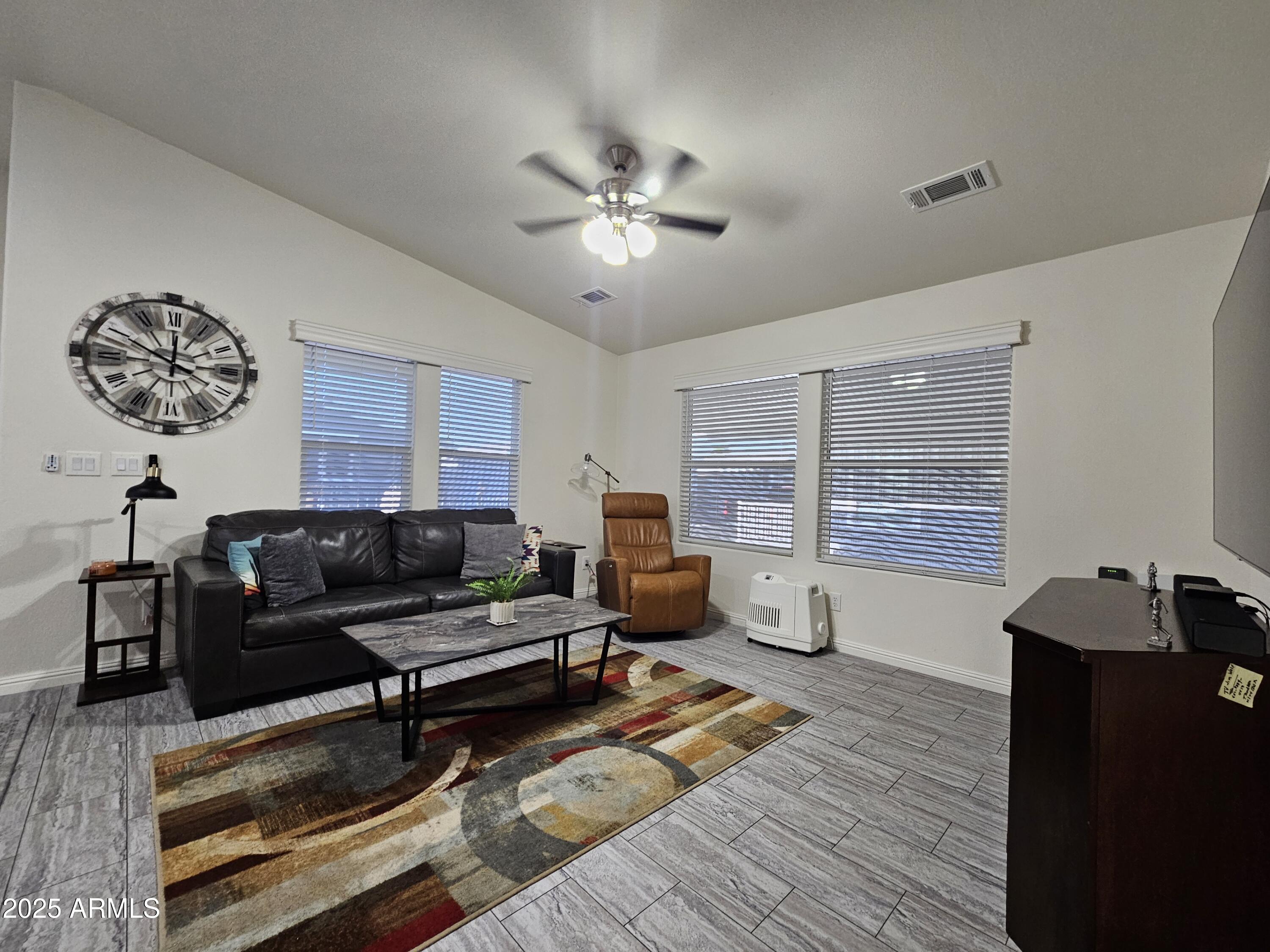 650 North Hawes Road, Unit 3124 Mesa, AZ 85207 - Photo 16 of 45 a living room with furniture and a window