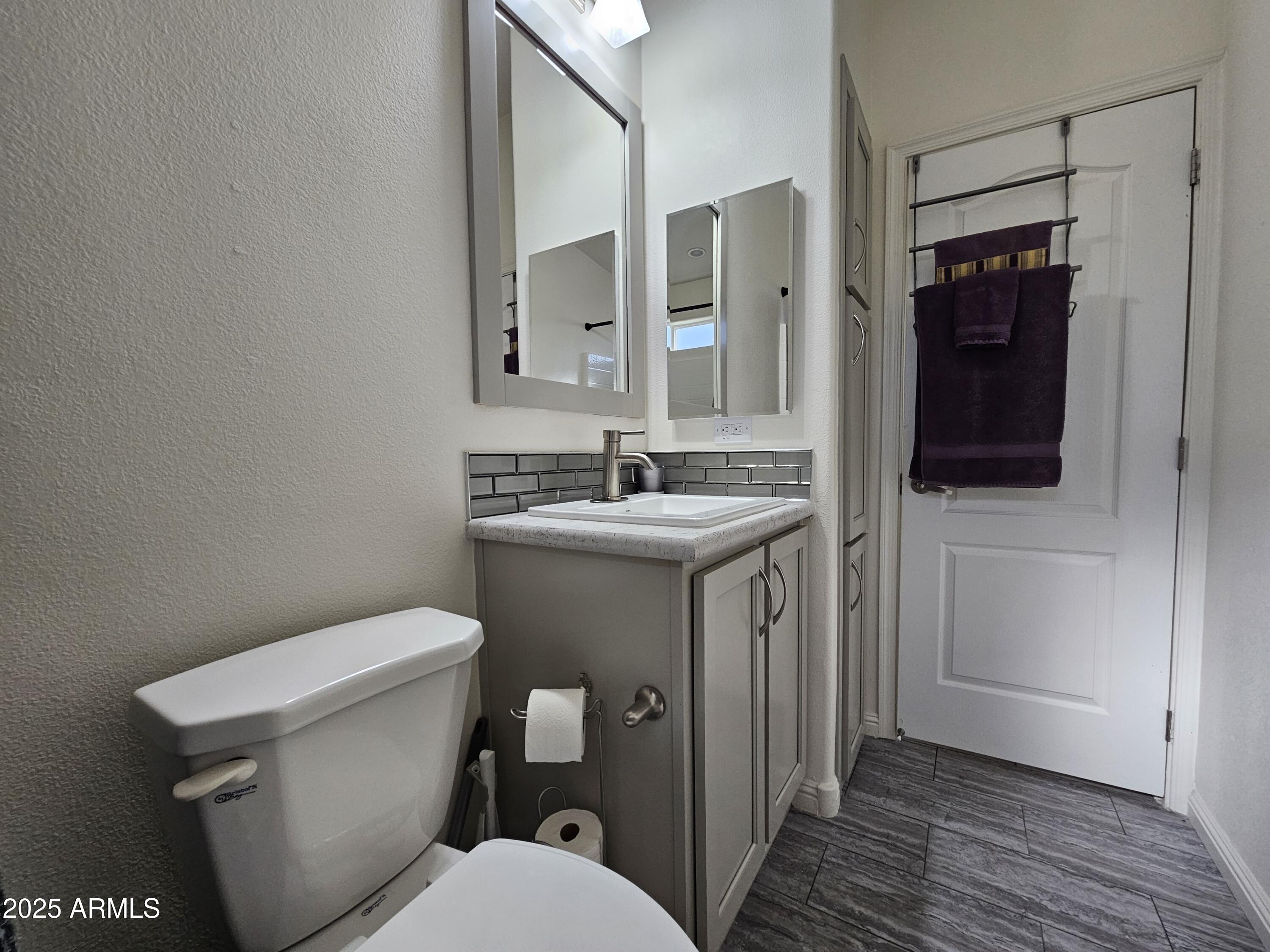 650 North Hawes Road, Unit 3124 Mesa, AZ 85207 - Photo 19 of 45 a bathroom with a sink and a toilet