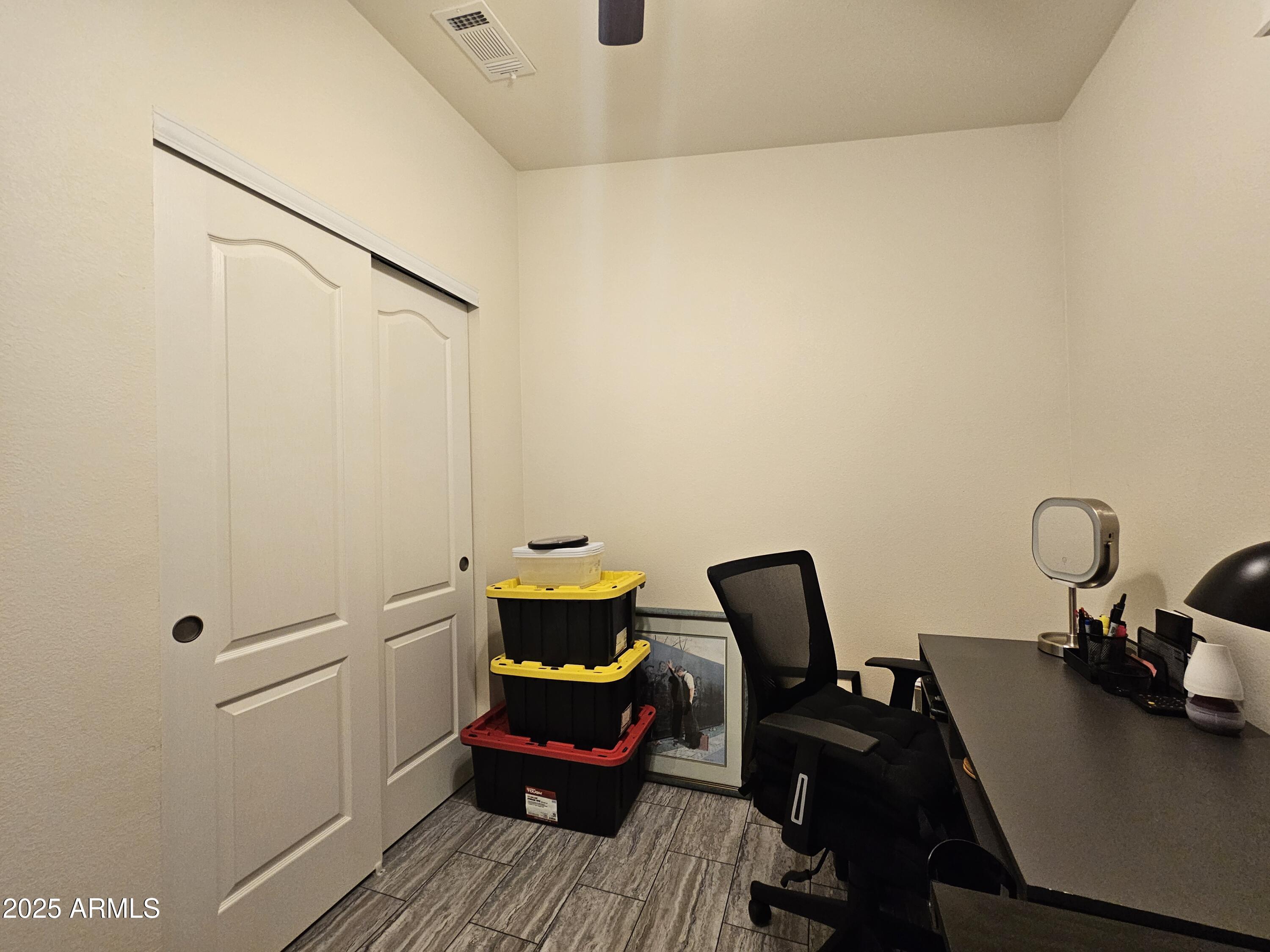 650 North Hawes Road, Unit 3124 Mesa, AZ 85207 - Photo 21 of 45 a view of a workspace with furniture and wooden floor