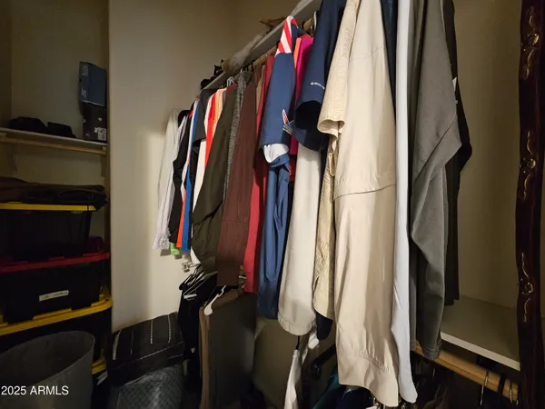 a bathroom with a sink a toilet a mirror and shower