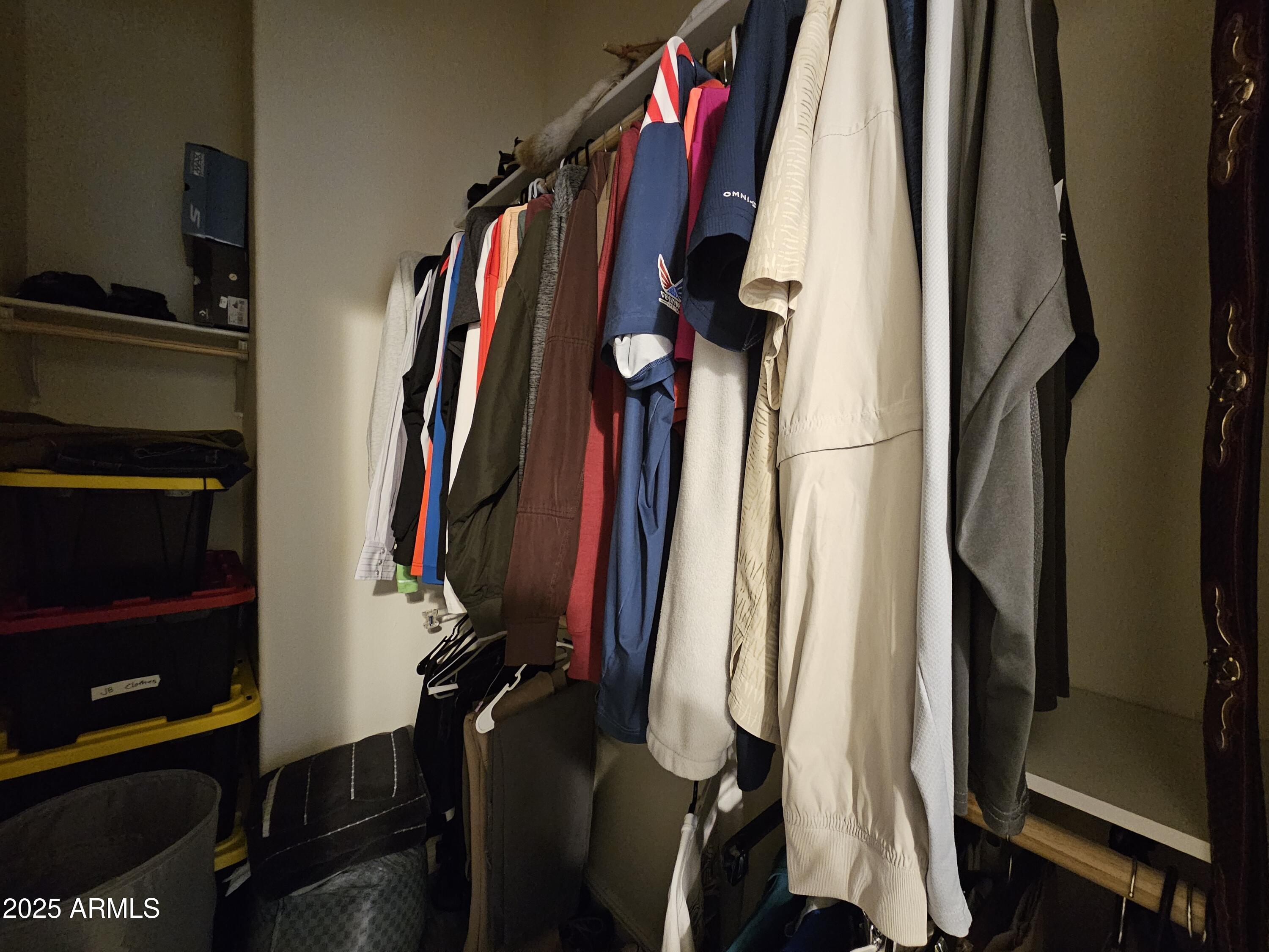650 North Hawes Road, Unit 3124 Mesa, AZ 85207 - Photo 27 of 45 a view of walk in closet with clothes and shoes