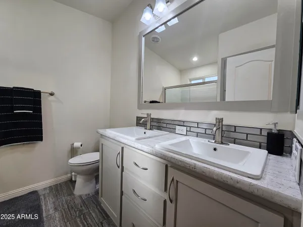 a bathroom with a glass shower door