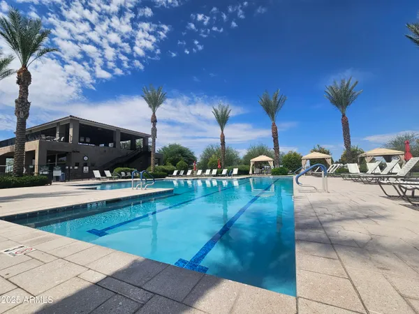a view of swimming pool with outdoor seating and city view