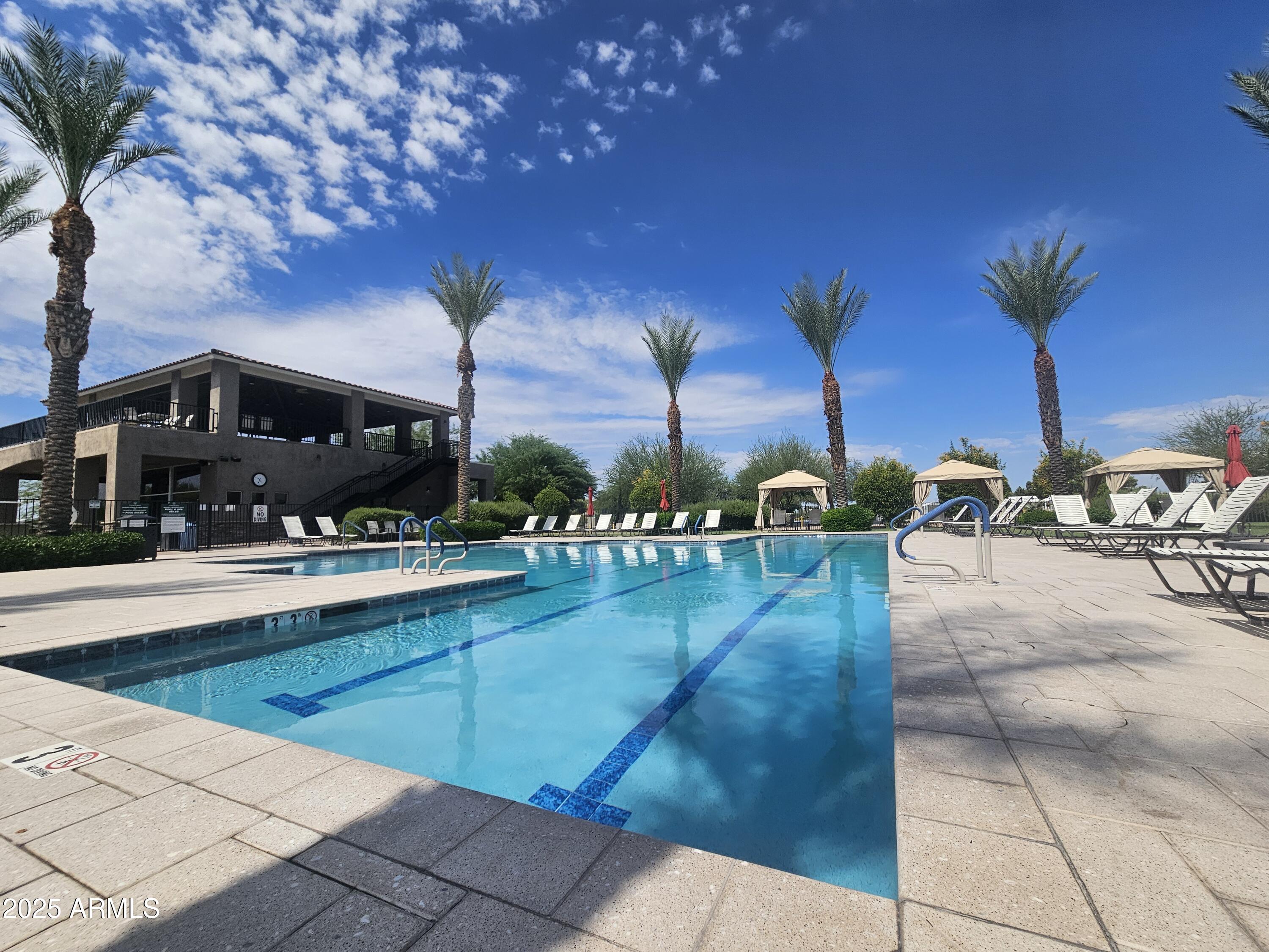 650 North Hawes Road, Unit 3124 Mesa, AZ 85207 - Photo 32 of 45 a view of a swimming pool with a patio