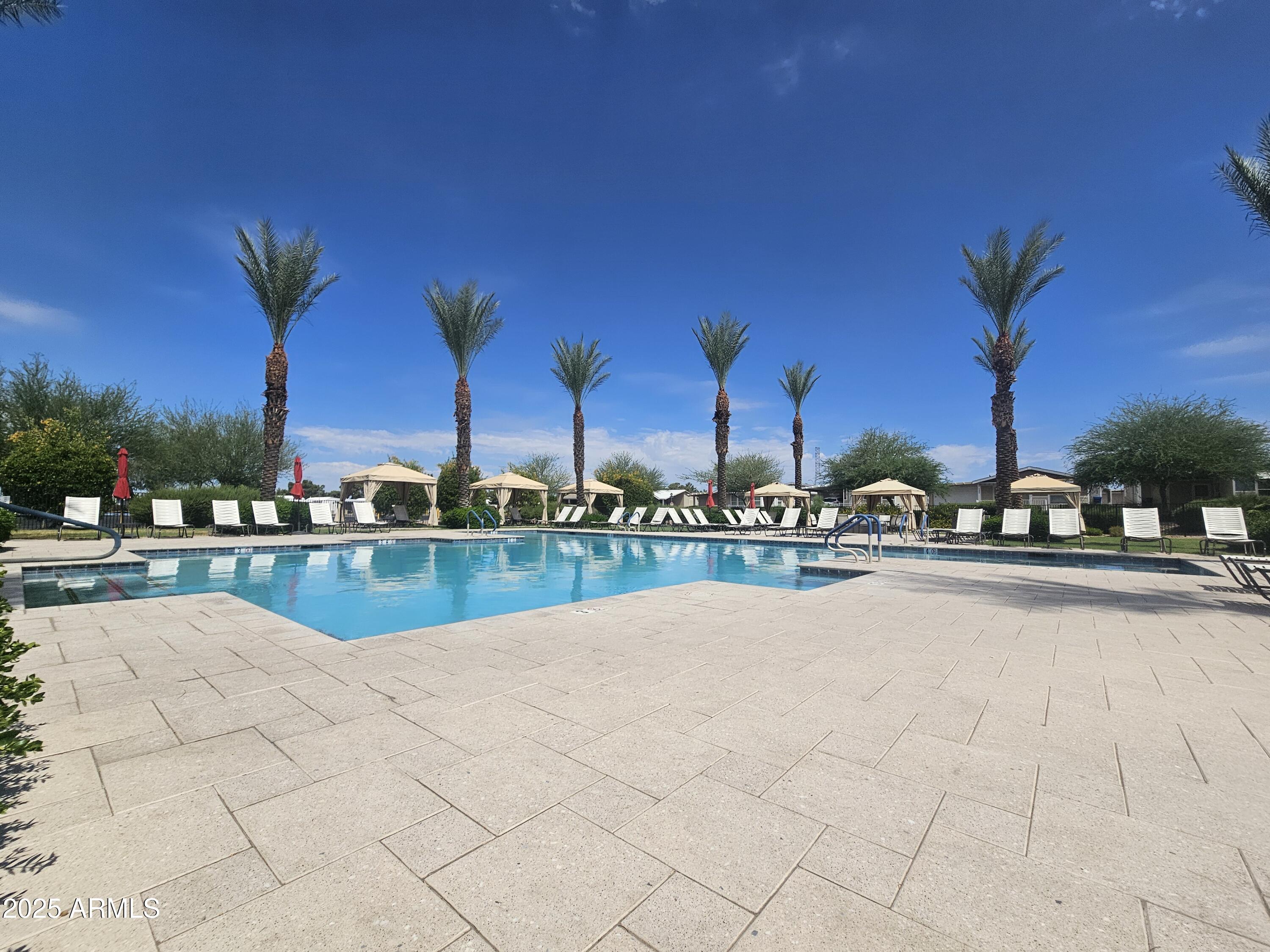 650 North Hawes Road, Unit 3124 Mesa, AZ 85207 - Photo 33 of 45 a view of swimming pool with outdoor seating and city view