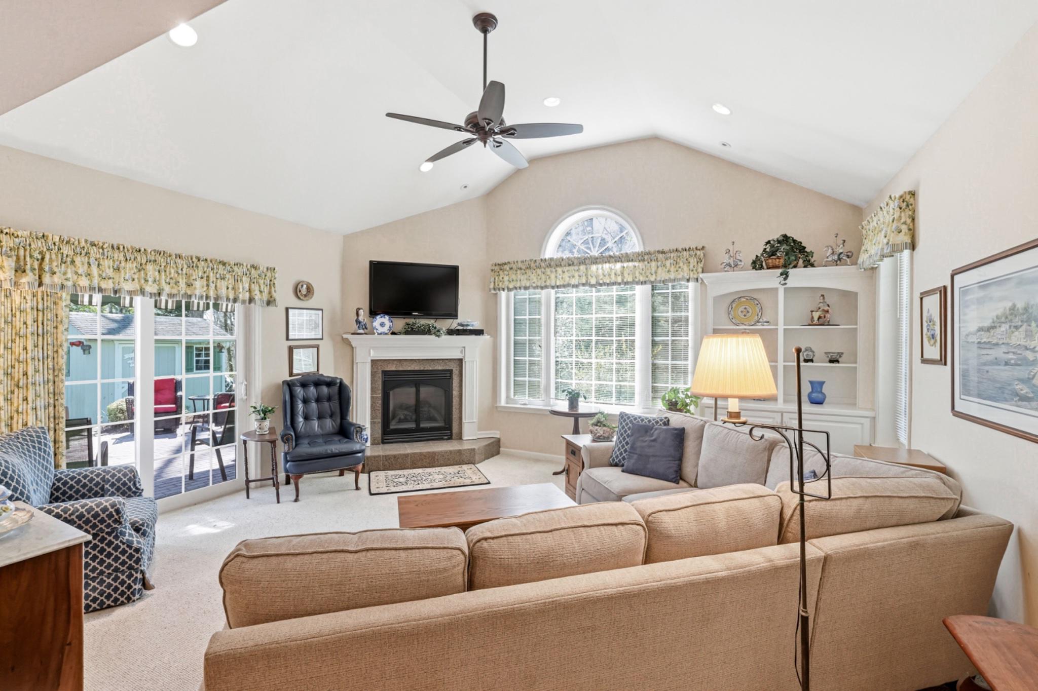 6 Laurel Lane Media, PA 19063 - Photo 14 of 52 a living room with furniture a fireplace and a flat screen tv