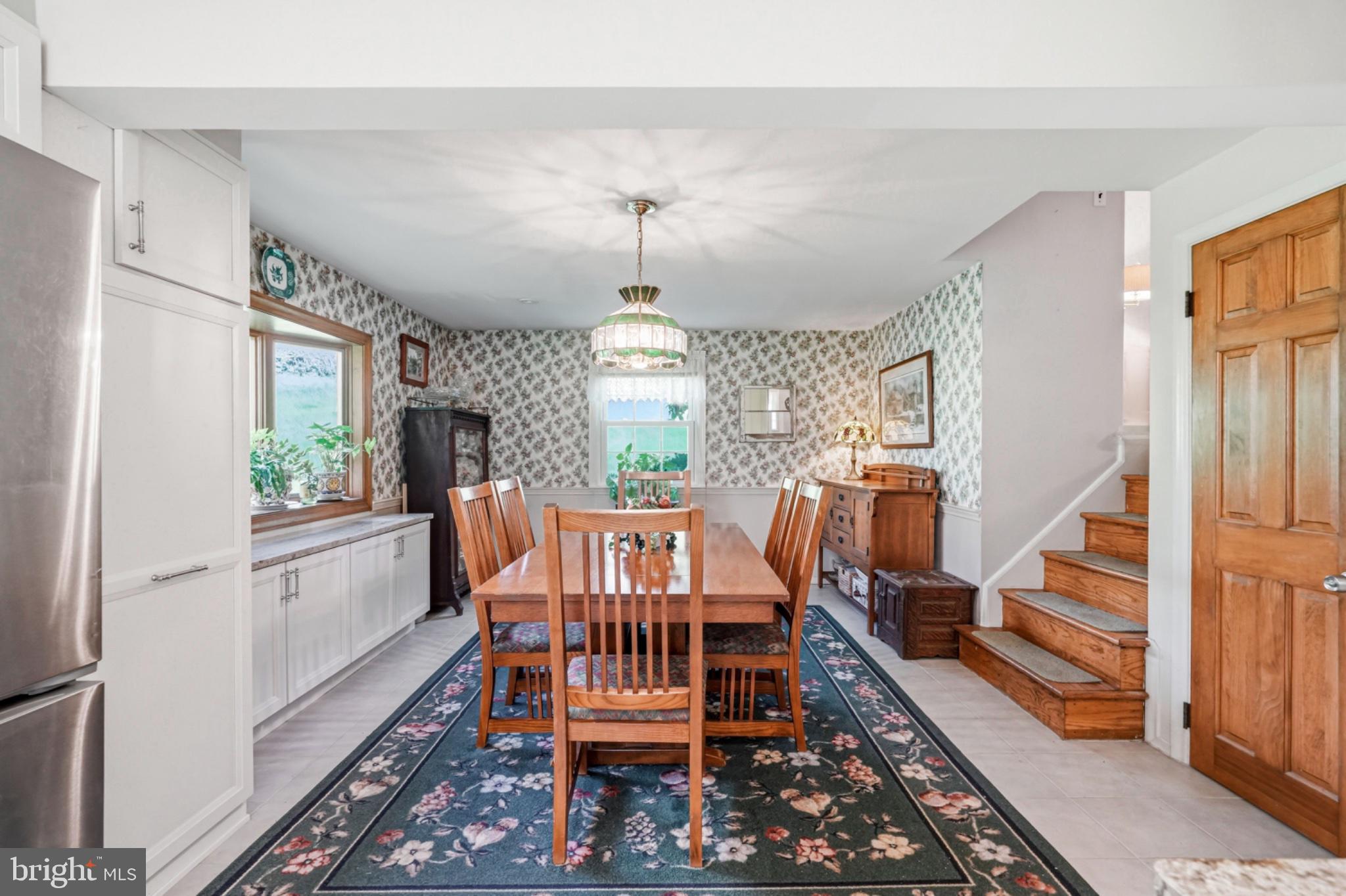 6 Laurel Lane Media, PA 19063 - Photo 23 of 52 a dining room with furniture a chandelier and wooden floor