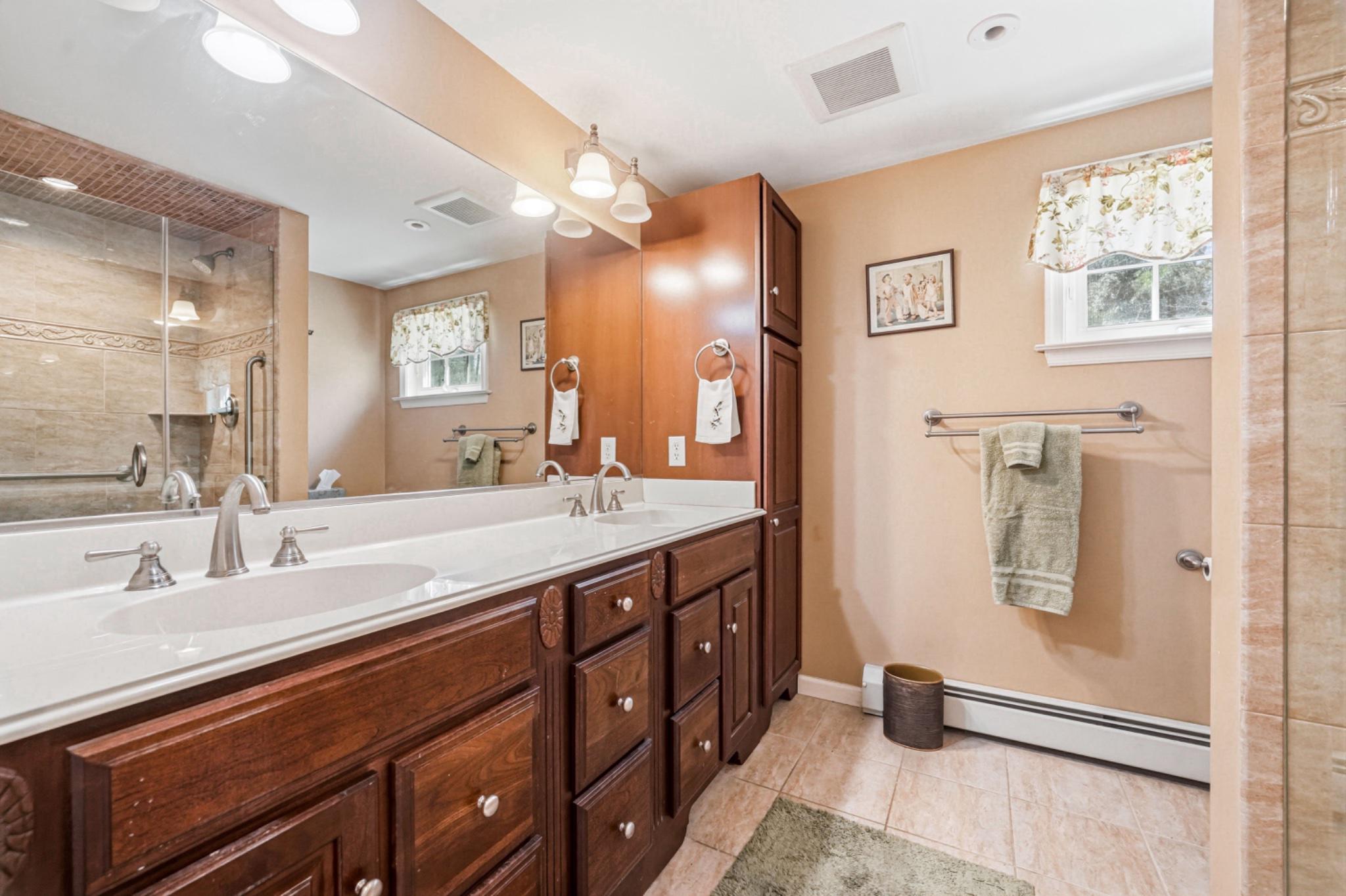 6 Laurel Lane Media, PA 19063 - Photo 33 of 52 a spacious bathroom with a double vanity sink a mirror and a shower