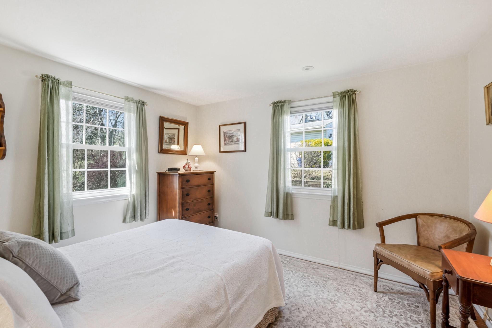 6 Laurel Lane Media, PA 19063 - Photo 35 of 52 a bedroom with a bed and a window with chair