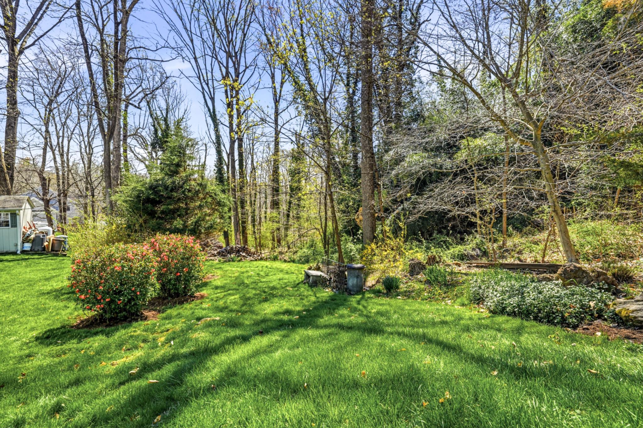 6 Laurel Lane Media, PA 19063 - Photo 43 of 52 a backyard of a house with lots of green space