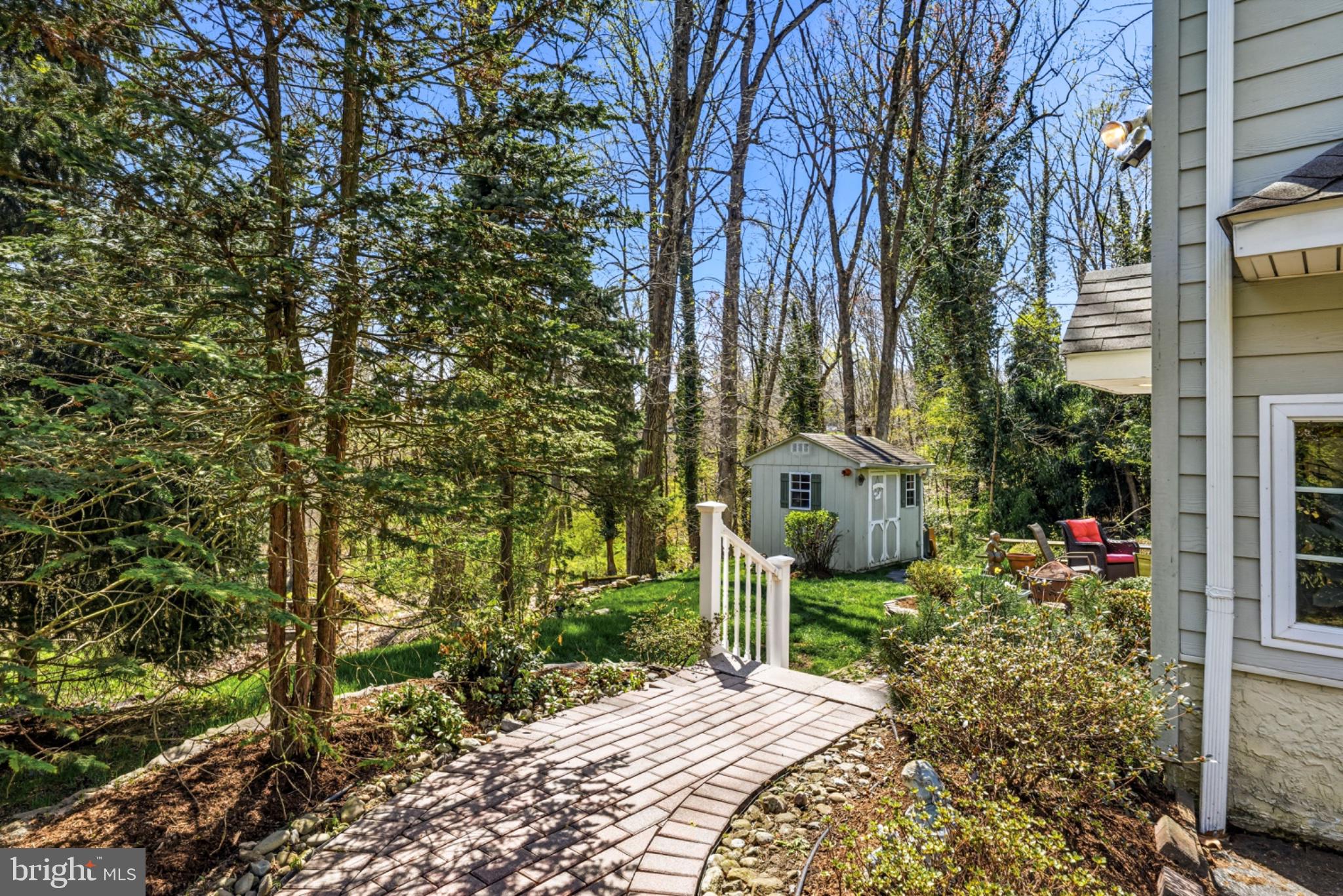 6 Laurel Lane Media, PA 19063 - Photo 47 of 52 a view of a garden with potted plants and large trees