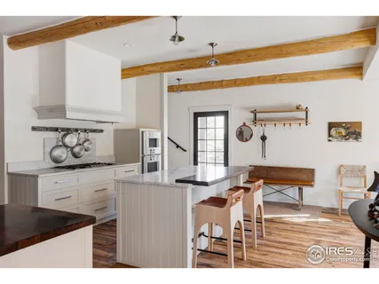 a kitchen with a table and chairs