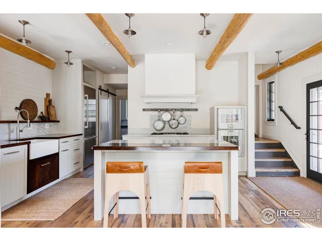a view of kitchen with cabinets and stove