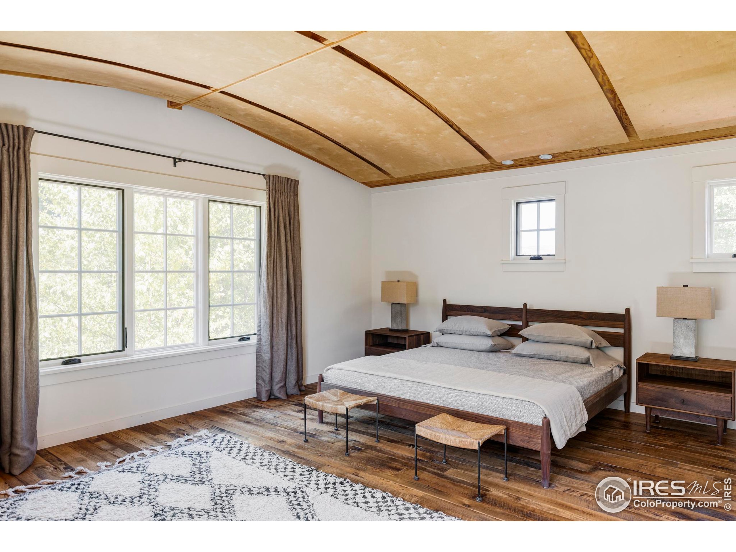 15789 North 83rd Street Longmont, CO 80503 - Photo 18 of 40 a bedroom with a bed and a window