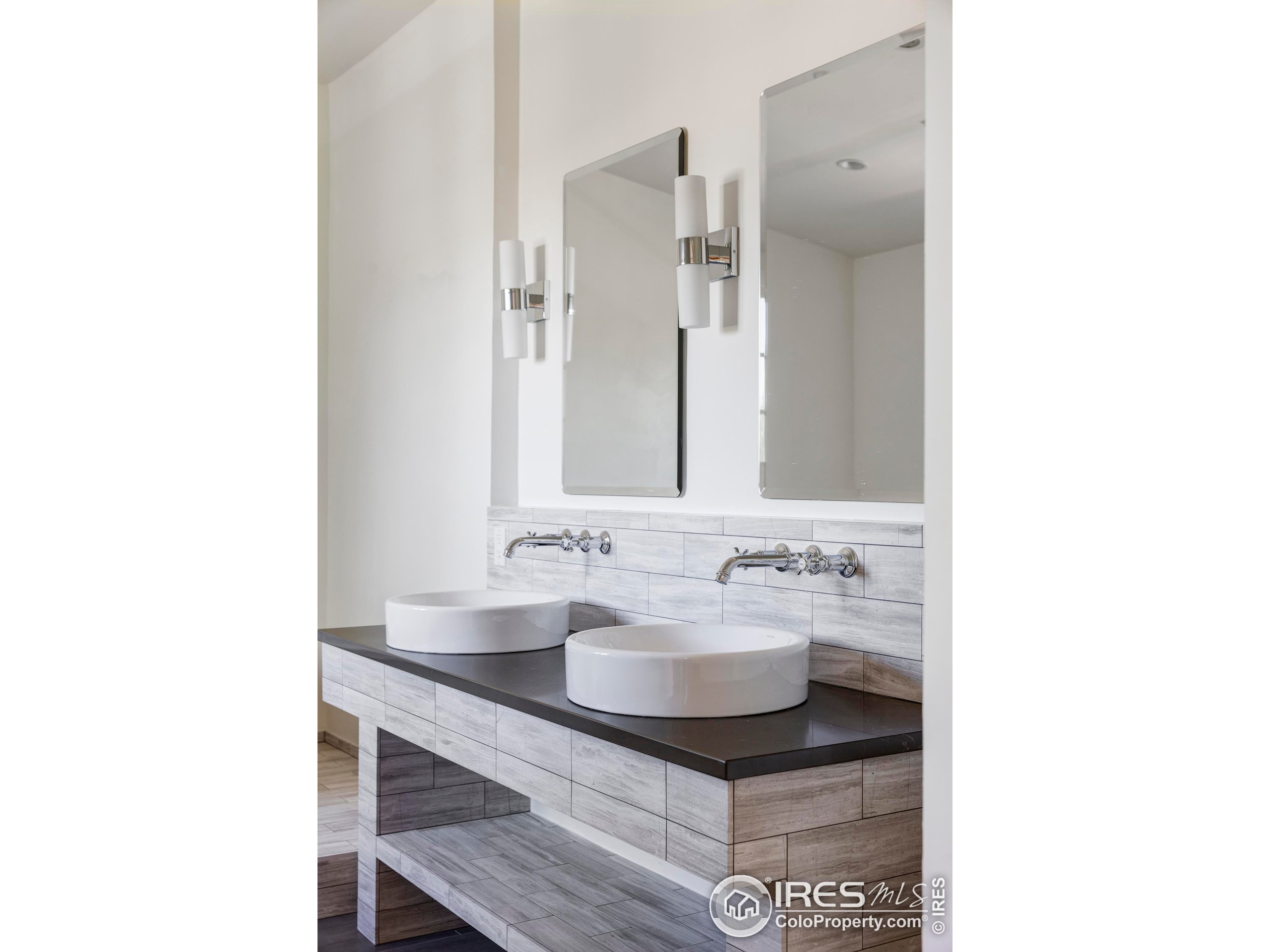 15789 North 83rd Street Longmont, CO 80503 - Photo 21 of 40 a bathroom with a sink and a mirror