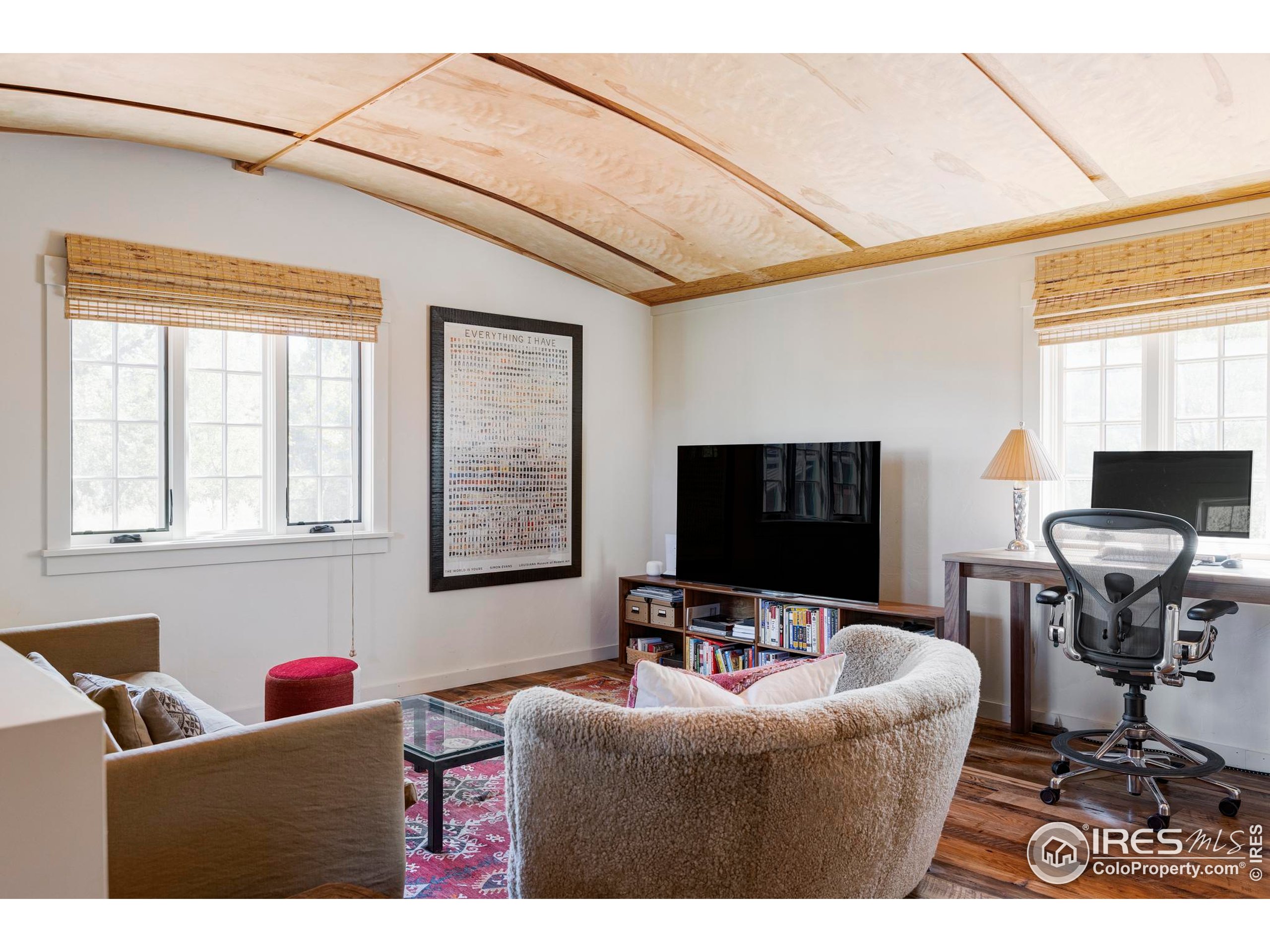 15789 North 83rd Street Longmont, CO 80503 - Photo 22 of 40 a living room with furniture and a flat screen tv