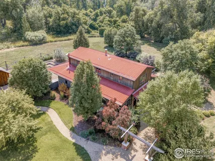 a view of a house with a yard and a pool
