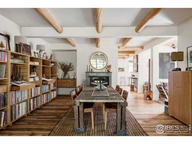 a living room with furniture a clock and a clock