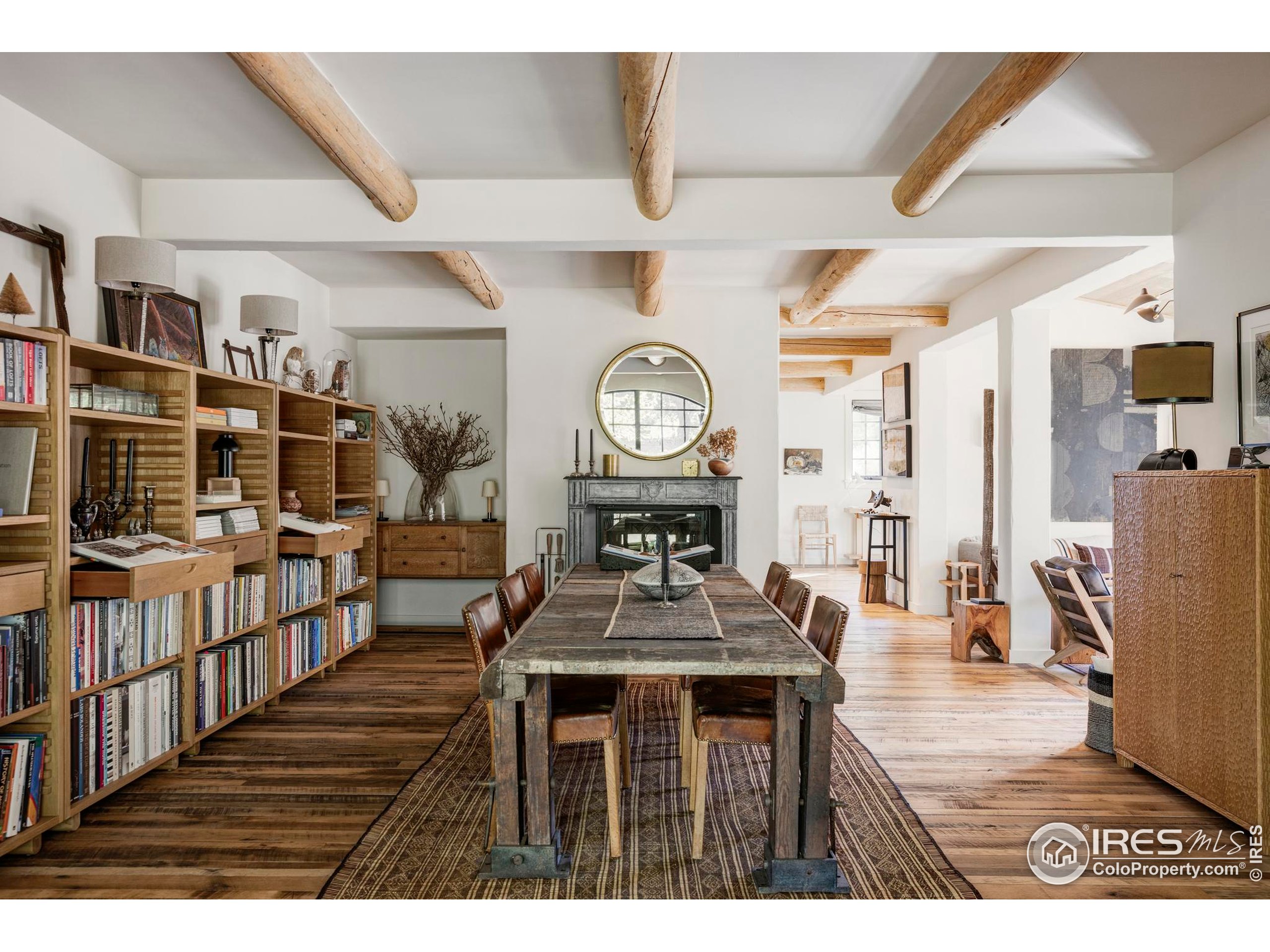 15789 North 83rd Street Longmont, CO 80503 - Photo 3 of 40 a living room with furniture a clock and a clock