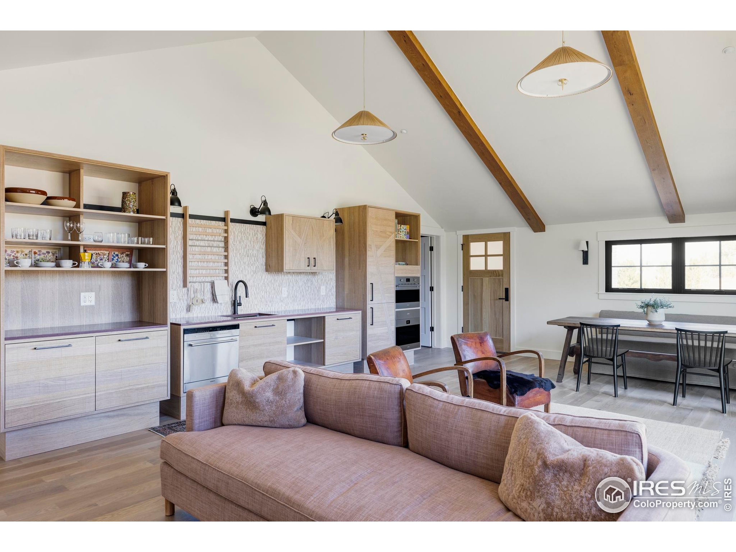 15789 North 83rd Street Longmont, CO 80503 - Photo 33 of 40 a living room with furniture and kitchen view