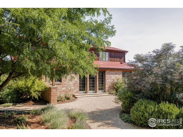 a view of a house with a tree