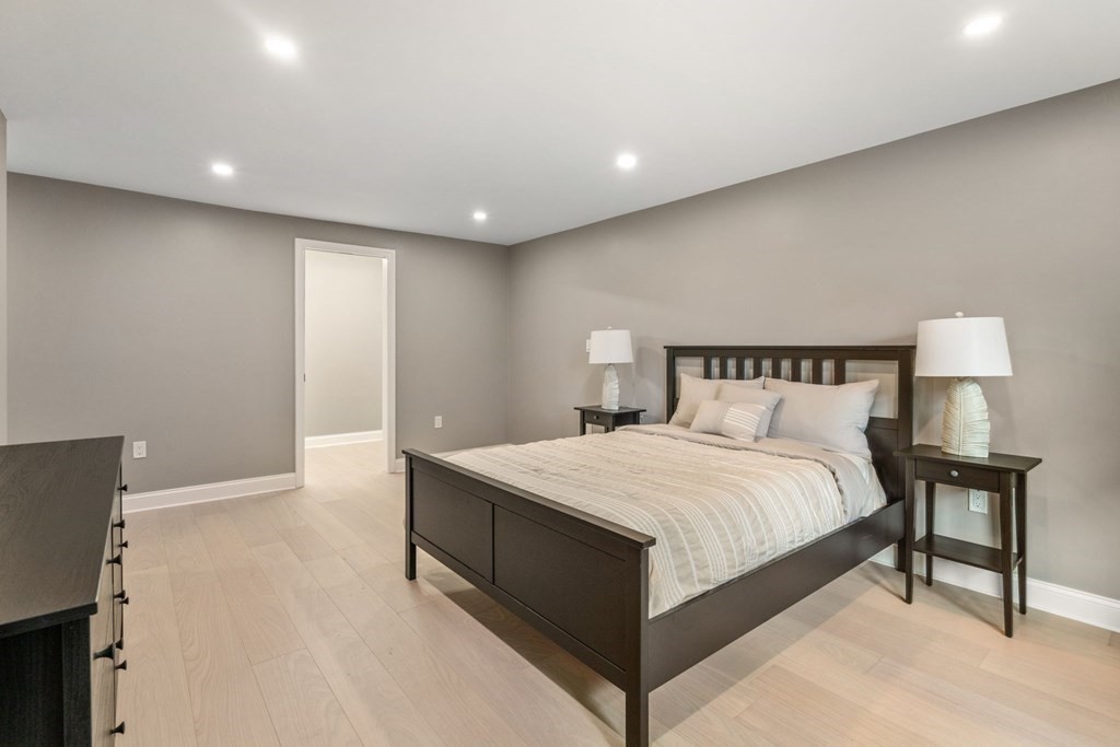 3 Emerson Road Wayland, MA 01778 - Photo 18 of 24 a bedroom with a bed and a night stand