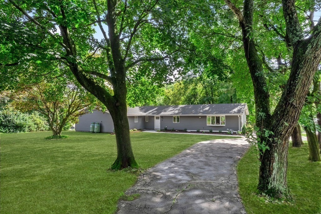 3 Emerson Road Wayland, MA 01778 - Photo 3 of 24 a front view of a house with a yard