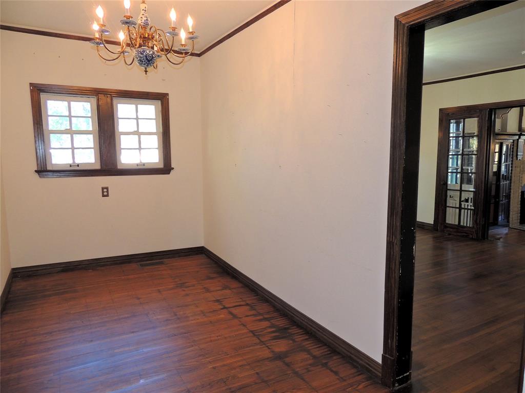 2102 Swenson Street Abilene, TX 79603 - Photo 11 of 40 a view of livingroom with hardwood floor and window