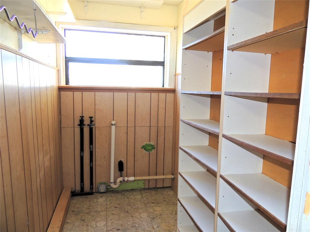 2102 Swenson Street Abilene, TX 79603 - Photo 14 of 40 a view of walk in closet with empty racks