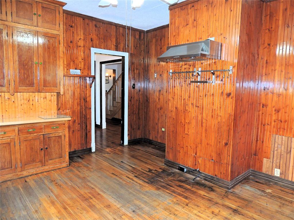 2102 Swenson Street Abilene, TX 79603 - Photo 15 of 40 a view of a hallway with wooden floor and windows