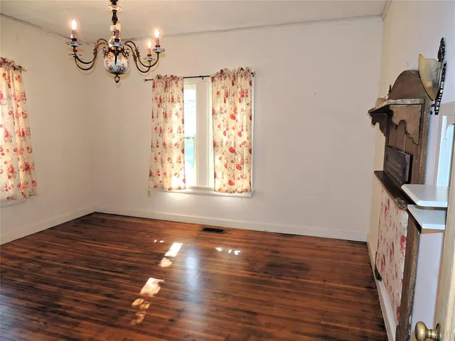 a view of entryway with wooden floor and stairs