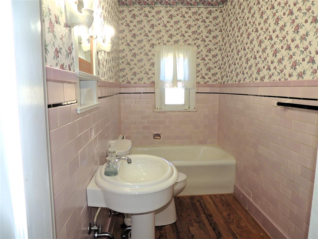 2102 Swenson Street Abilene, TX 79603 - Photo 27 of 40 a bathroom with a sink a toilet and shower