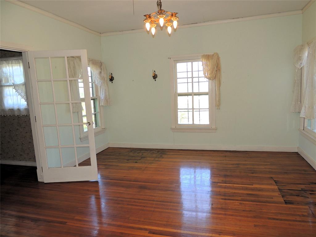 2102 Swenson Street Abilene, TX 79603 - Photo 28 of 40 a view of empty room with wooden floor and fan