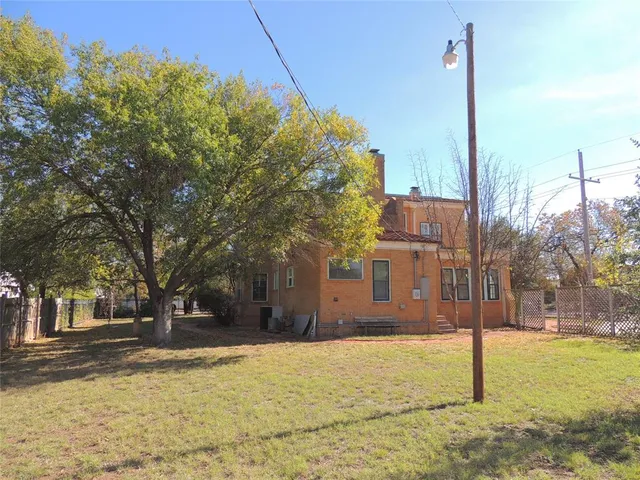 a view of a house with a tree