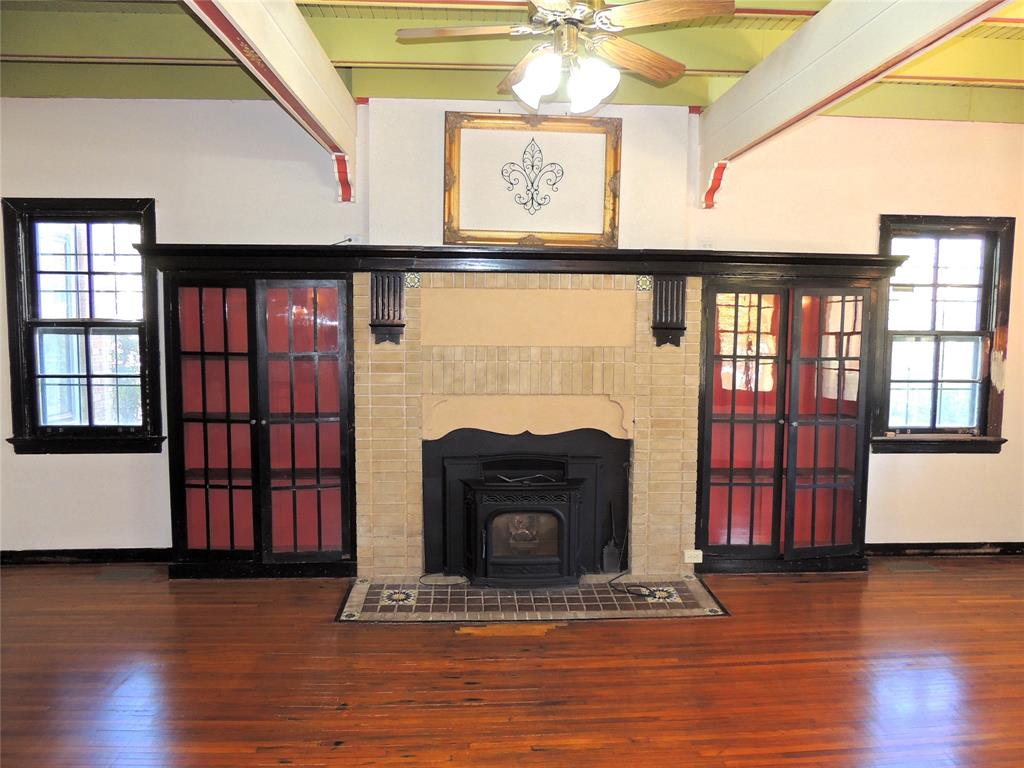 2102 Swenson Street Abilene, TX 79603 - Photo 5 of 40 a living room with fireplace furniture and a wooden floor