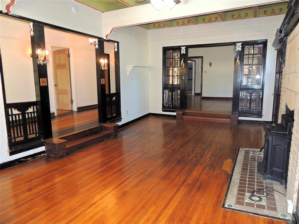2102 Swenson Street Abilene, TX 79603 - Photo 6 of 40 wooden floor in an empty room with a window