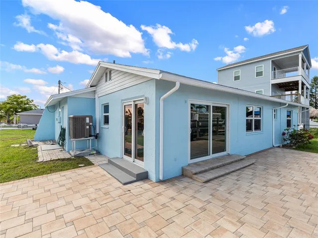 a view of an house with backyard space and garden