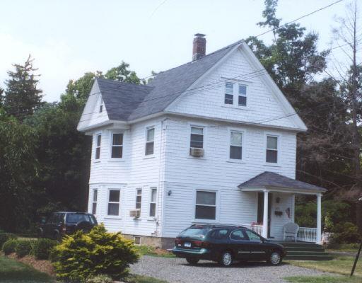 285 Mill Plain Road Fairfield, CT 06824 - Photo 1 of 1 a front view of a house with a garden